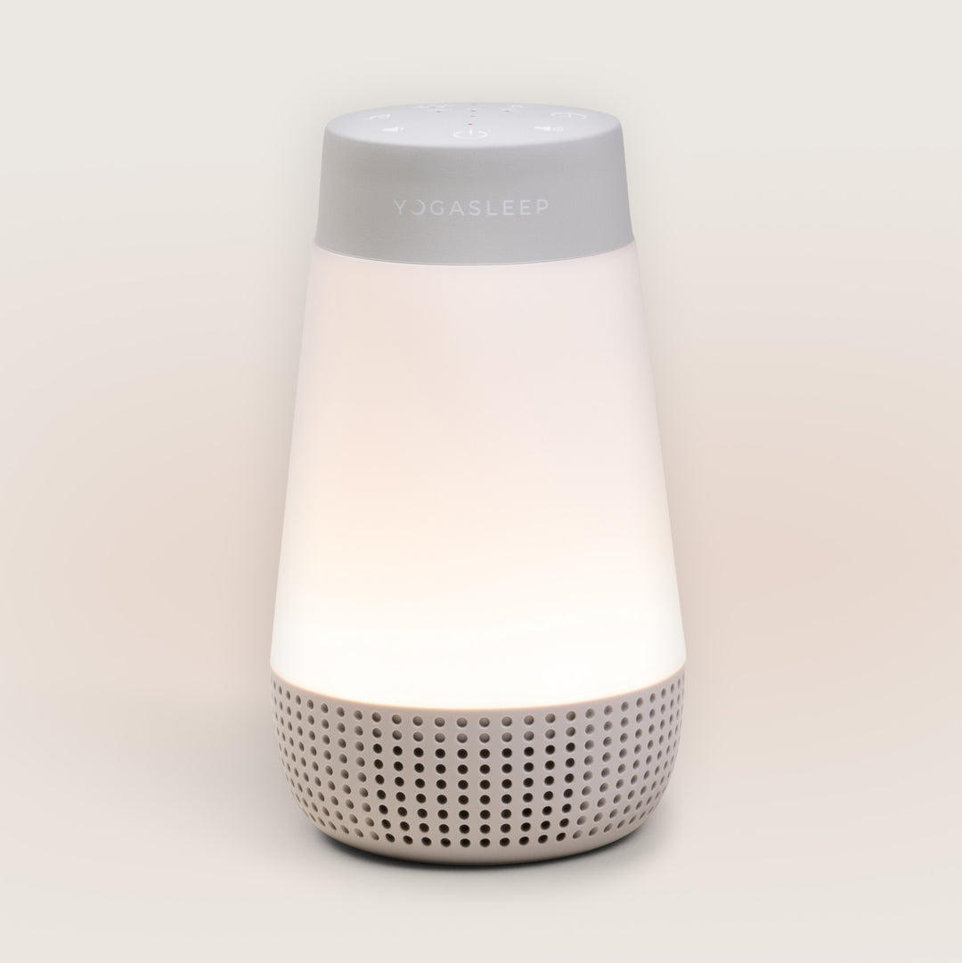 Front view of Travel-Friendly Baby Soother showcasing its glowing night-light and speaker grille against a light background
