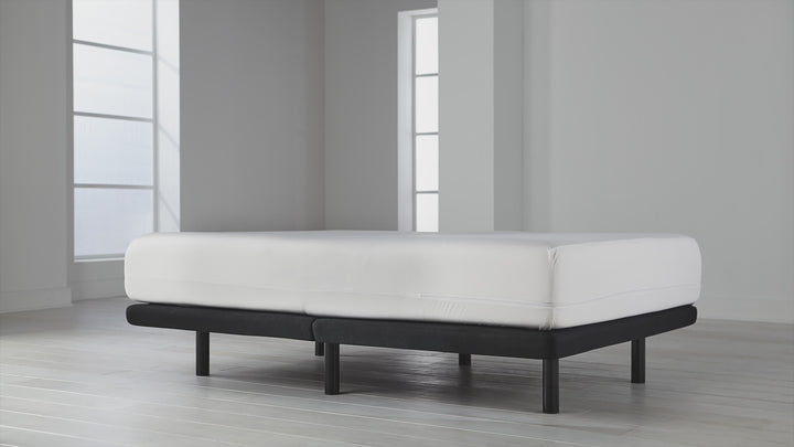 Angled view of OmniGuard Total Encasement Mattress Protector showing full-encasement fit and smooth white fabric